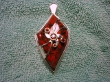 Sterling silver with fantasy cut briccated jasper and garnets