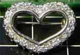 Customer had 10 single cut diamond, wanted diamonds added and wide heart pin made.  No Problem :)