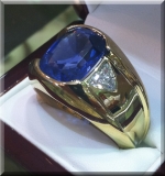 12 ct sapphire and 1.30 tw diamond trillions.  18k yellow gold.
size 13