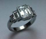 2ct emerald cut center 4=1.24 ct  side baguettes.
Designed with 3dengarve and milled with the 3dwaxmill Rotary
Hand cut air lines in the wax before casting.